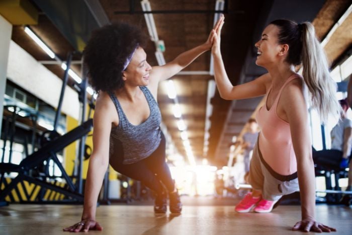 beautiful-fit-women-working-out-in-gym-together