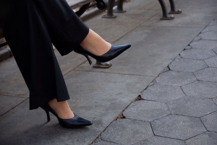 close-up-of-businesswomans-crossed-legs