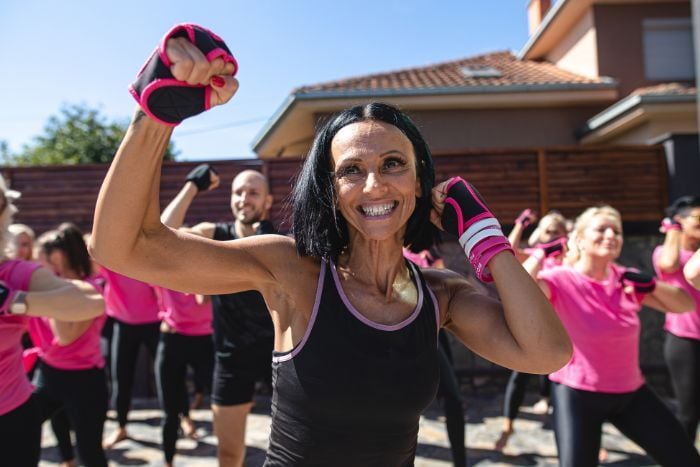 mature-aerobics-group-exercising-together