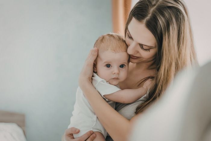 mother-holding-baby-close
