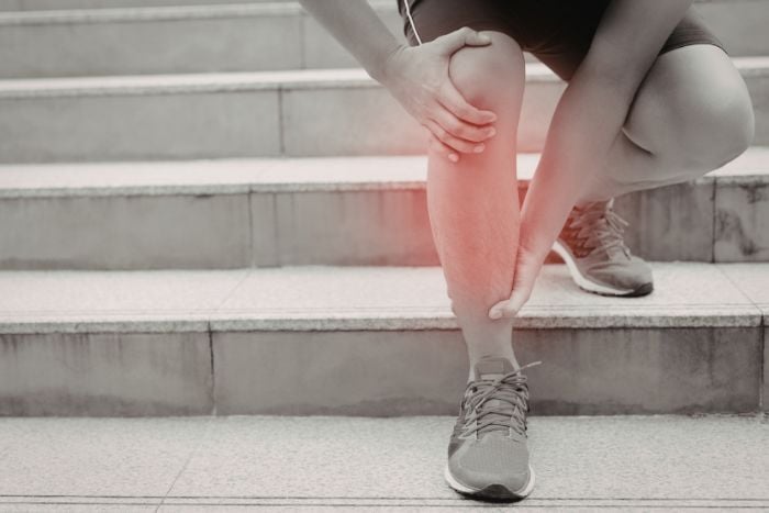 person-suffering-from-knee-pain-on-stairs