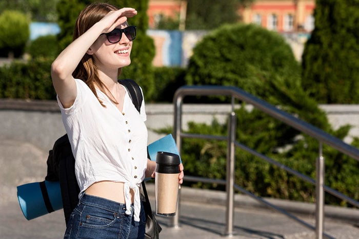 side-view-of-tourist-woman-with-backpack