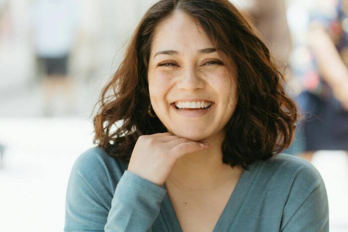 smiling-woman-outdoors-with-happy-expression