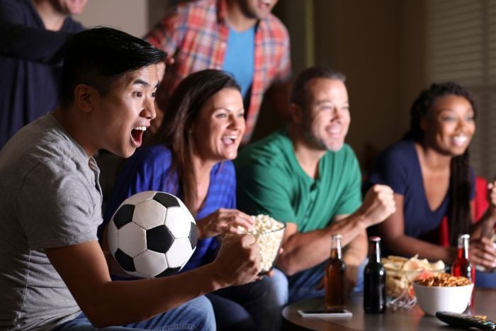 soccer-fans-watching-the-game-at-home-on-television