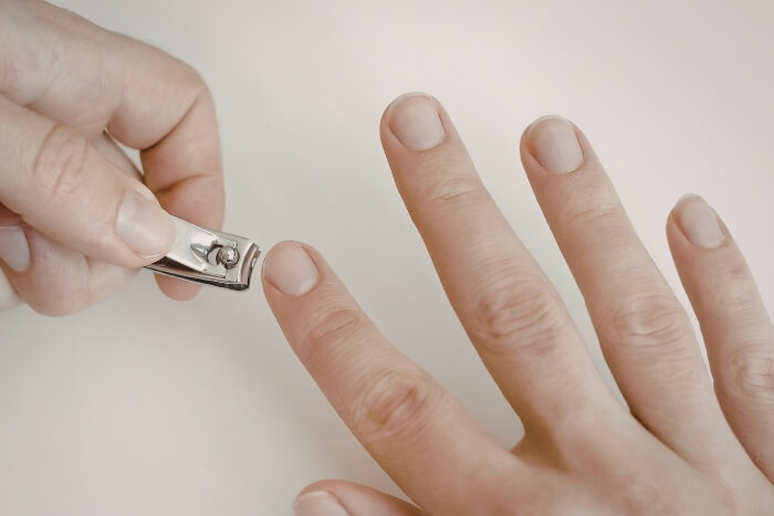 trimming-fingernails-with-nail-clippers