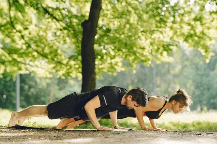 woman-and-man-doing-push-ups