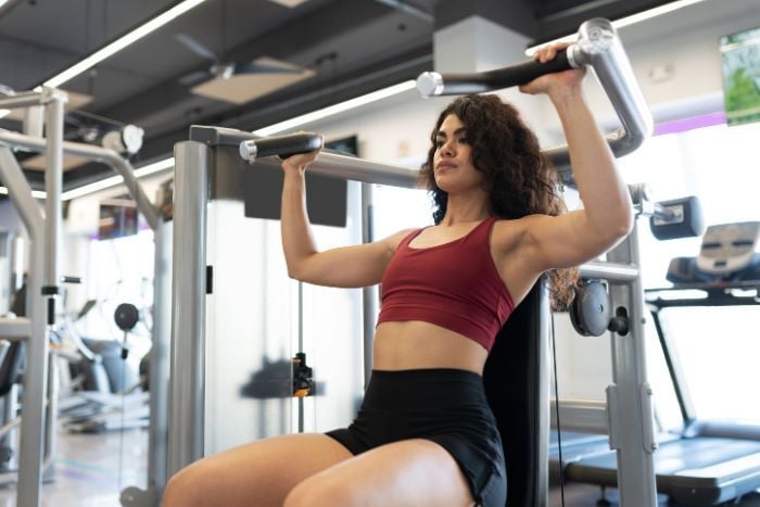 woman-exercising-with-a-shoulder-press-machine-1