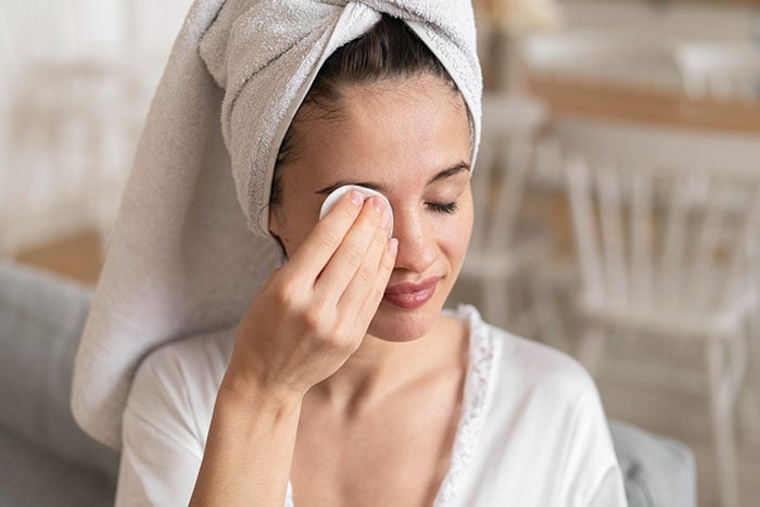 woman-using-make-up-remover