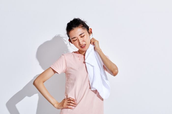 woman-wiping-sweat-after-exercise
