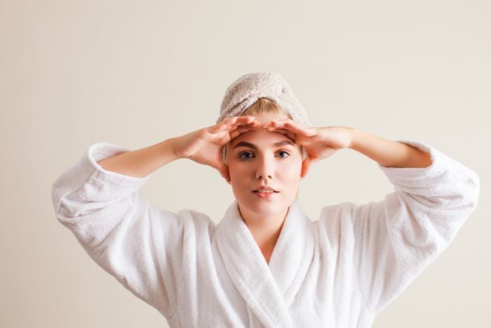 young-woman-practicing-facial-self-massage
