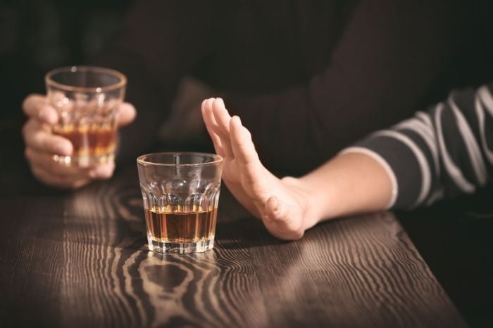 woman-refusing-to-drink-alcohol-in-bar